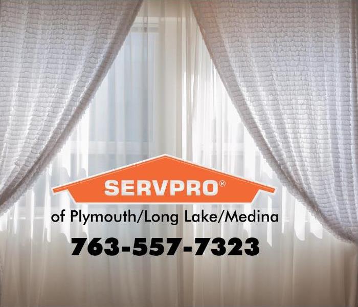 White drapes with a SERVPRO logo in the middle